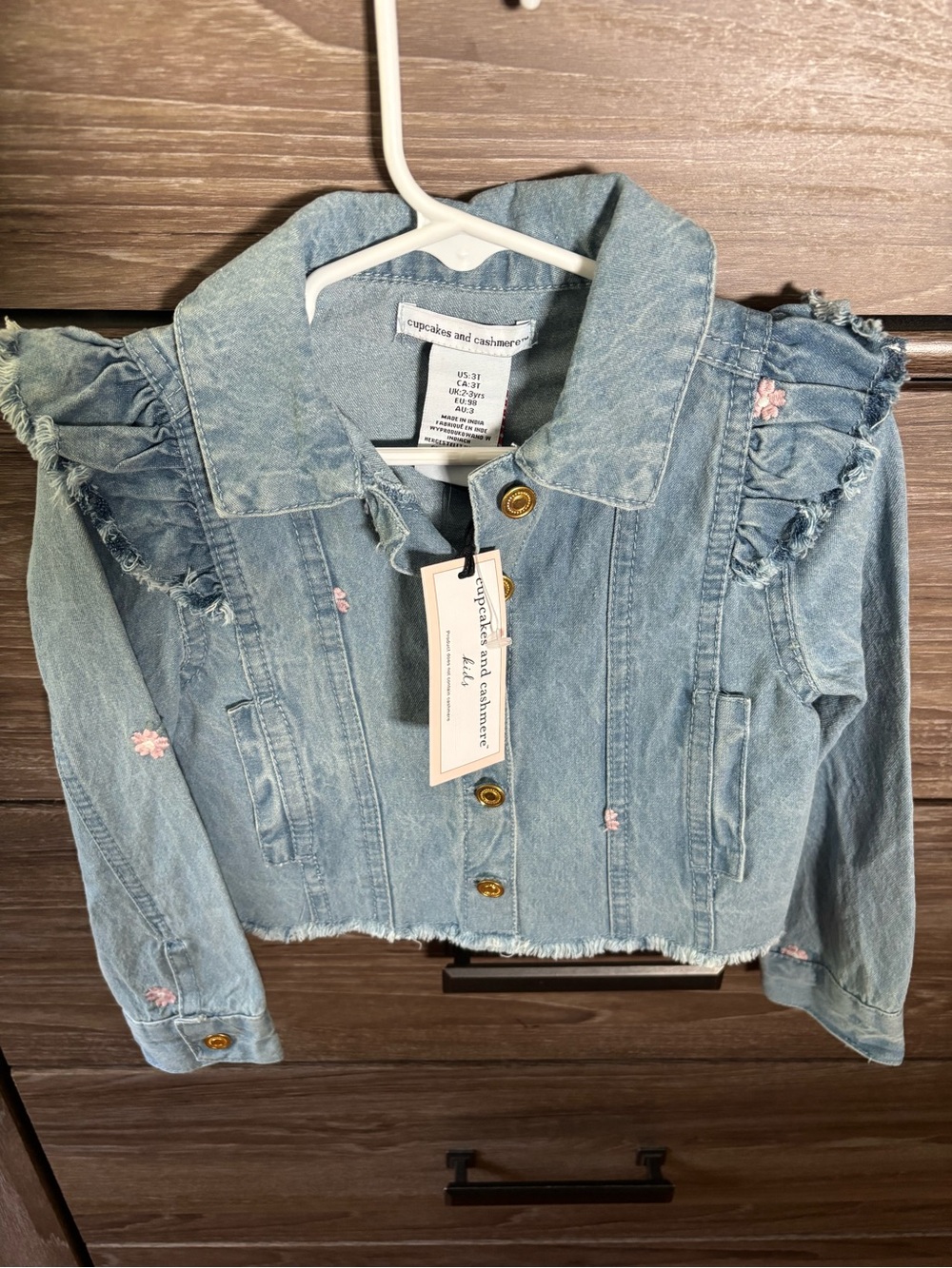 cupcakes & cashmere Pastel Blue Cropped Ruffle Denim Jacket with Pink Embroidery